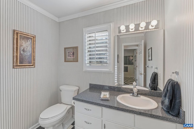 bathroom featuring toilet, wallpapered walls, ornamental molding, and vanity