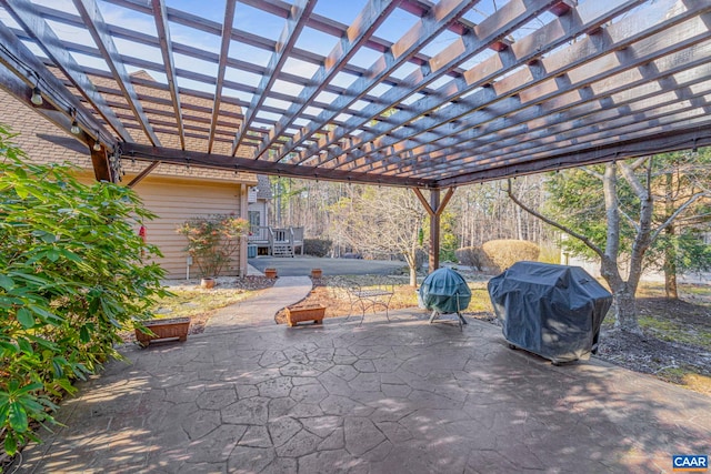 view of patio / terrace with grilling area and a pergola