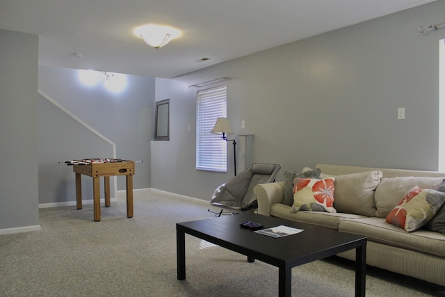 living room featuring light carpet