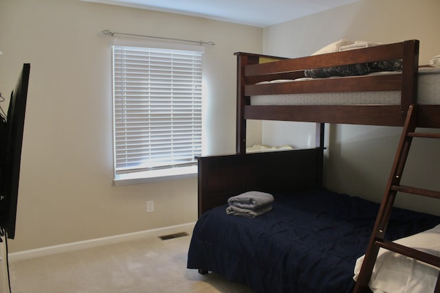 bedroom with light colored carpet