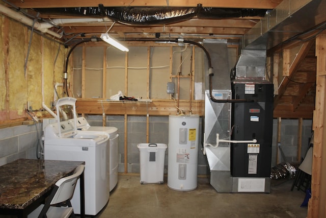 interior space with washing machine and dryer and electric water heater