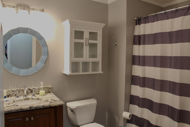 bathroom with crown molding, vanity, toilet, and a shower with shower curtain