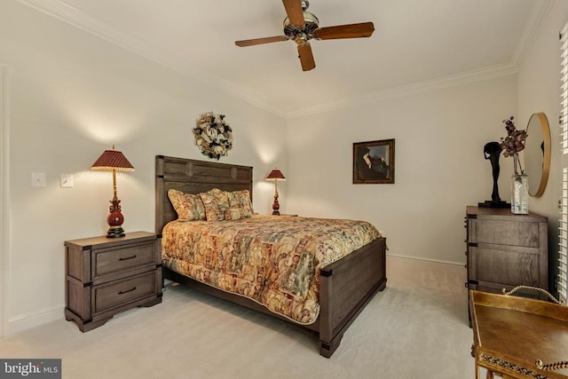 bedroom featuring crown molding, baseboards, and light colored carpet