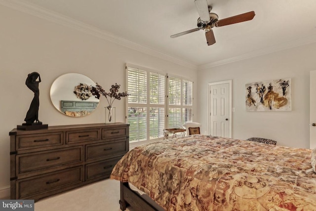 bedroom with ornamental molding, ceiling fan, and light carpet