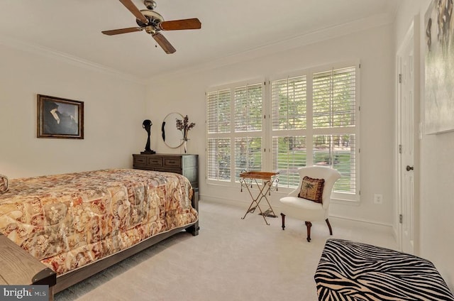 bedroom with crown molding, a ceiling fan, and carpet