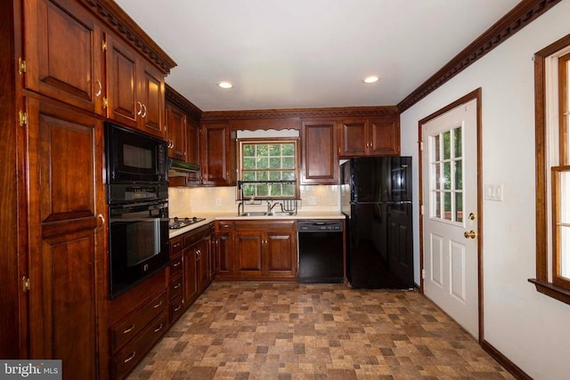 kitchen with sink, decorative backsplash, and black appliances