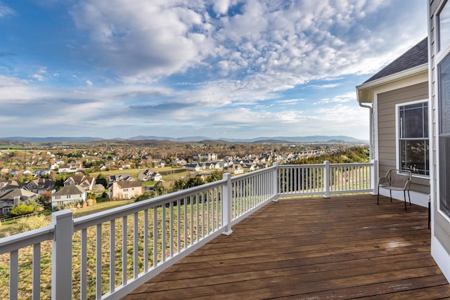 wooden deck with a mountain view