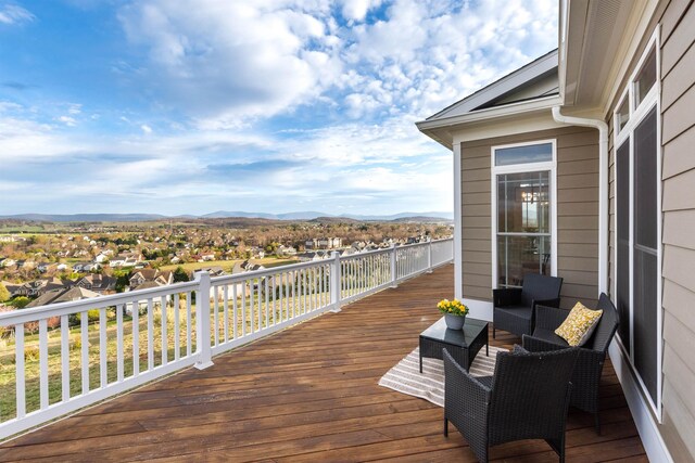 wooden terrace featuring a mountain view