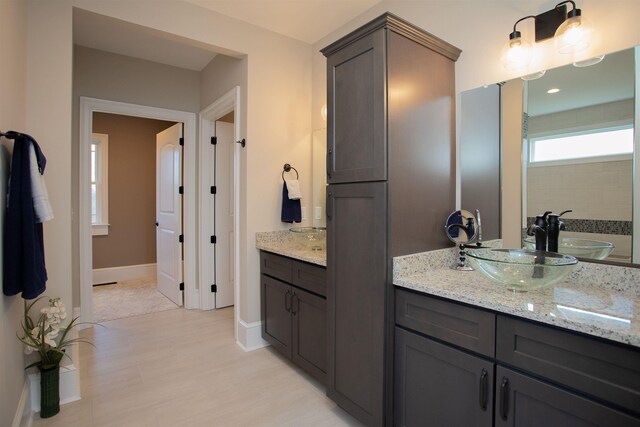 bathroom with vanity and hardwood / wood-style floors