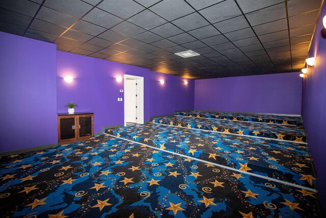 home theater room featuring a paneled ceiling