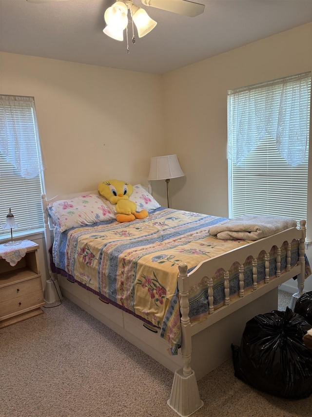 carpeted bedroom featuring a ceiling fan