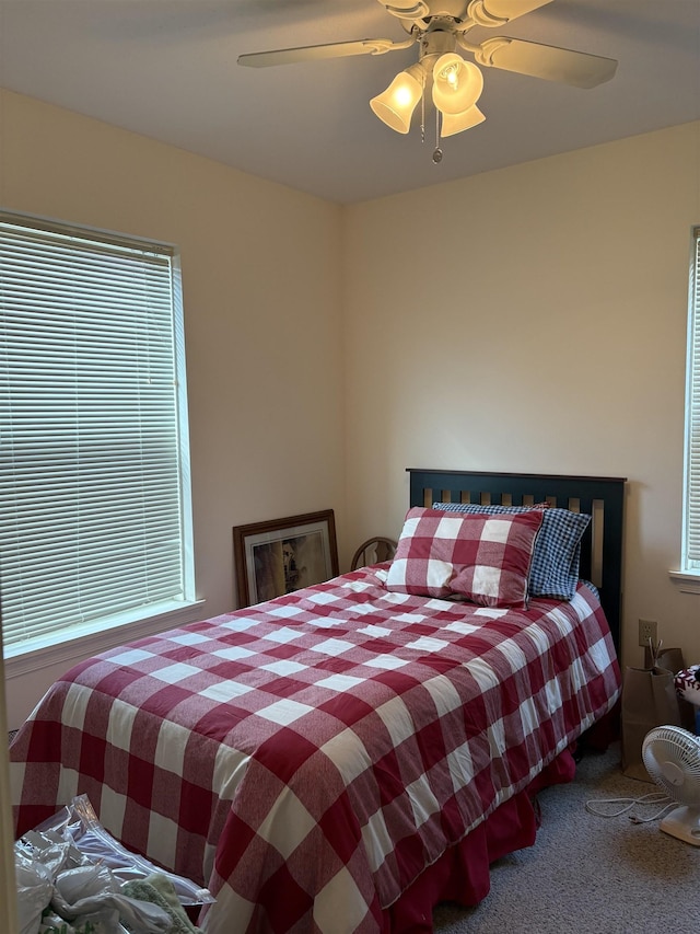 bedroom with carpet and a ceiling fan