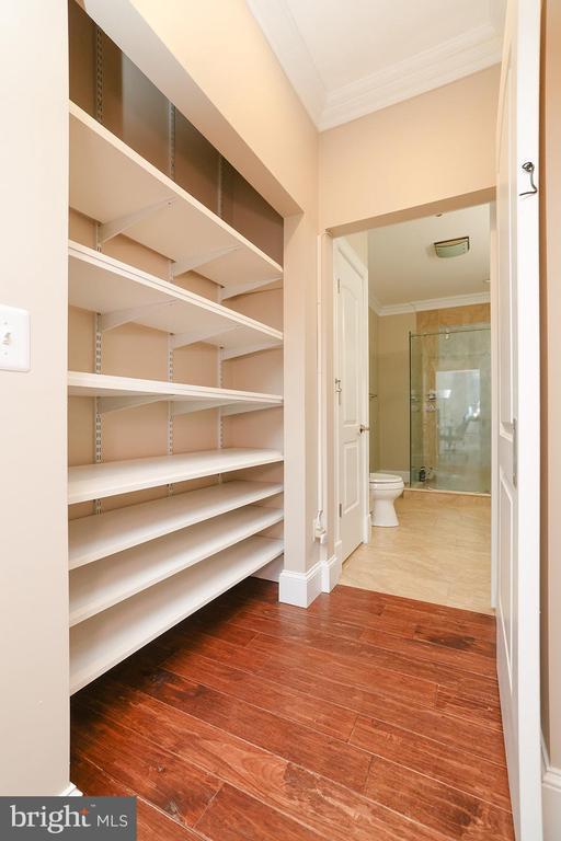 interior space featuring ornamental molding and wood-type flooring