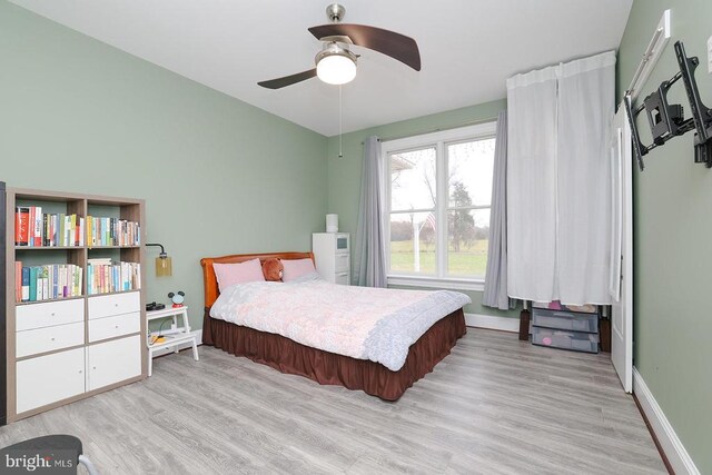 bedroom featuring light hardwood / wood-style flooring and ceiling fan