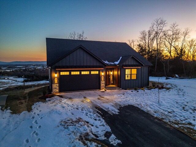 modern inspired farmhouse with a garage