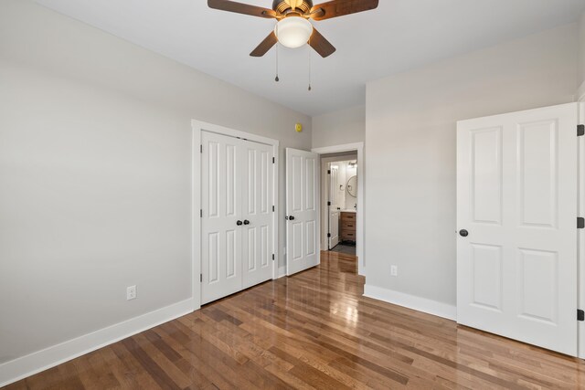 unfurnished bedroom with wood-type flooring and ceiling fan