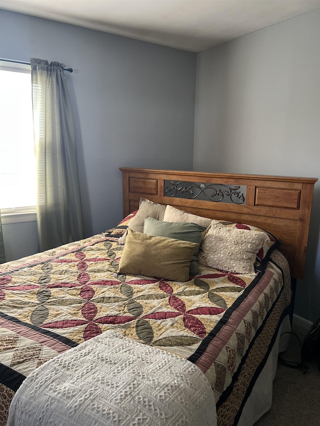 bedroom featuring multiple windows