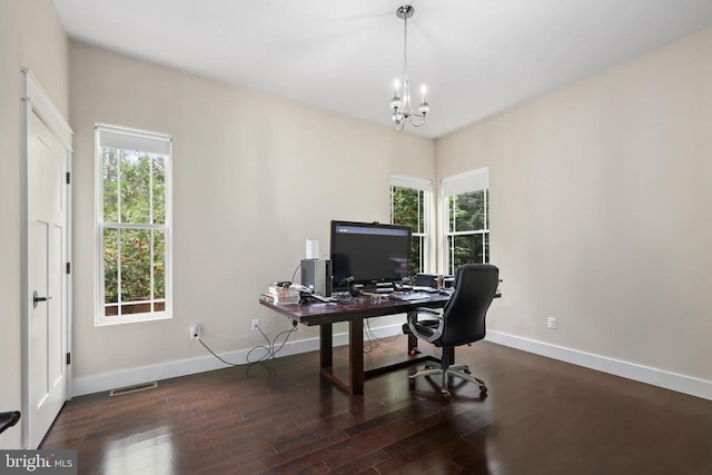 office area featuring an inviting chandelier, visible vents, baseboards, and wood finished floors