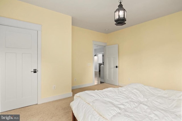 bedroom featuring carpet and baseboards