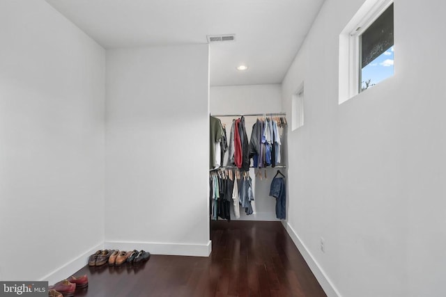 walk in closet featuring wood finished floors and visible vents