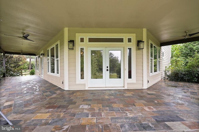 view of exterior entry featuring a ceiling fan and french doors