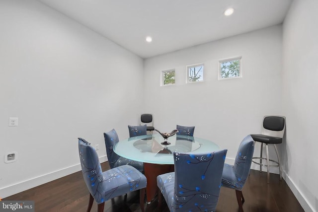 dining room featuring recessed lighting, wood finished floors, and baseboards