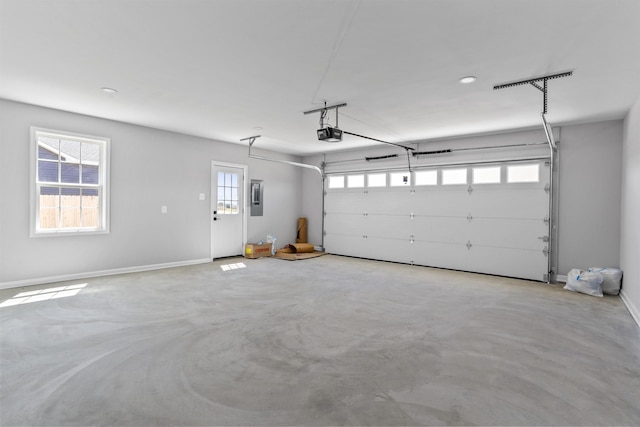 garage featuring a garage door opener and electric panel