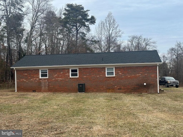 view of side of home featuring a yard