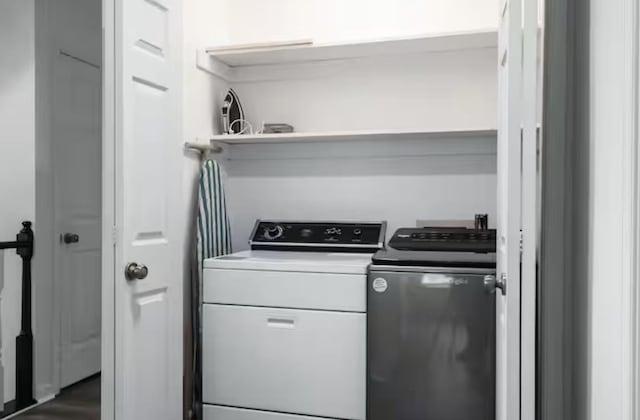 laundry area featuring independent washer and dryer and laundry area