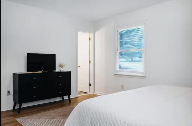 bedroom featuring wood finished floors