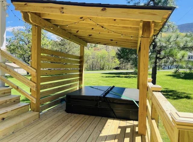 wooden terrace featuring a yard