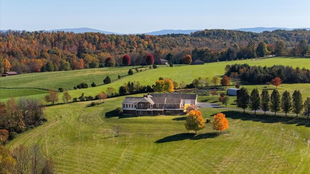 drone / aerial view with a rural view and a mountain view