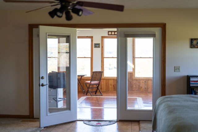 doorway to outside featuring ceiling fan