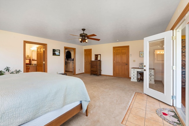 carpeted bedroom with connected bathroom and ceiling fan