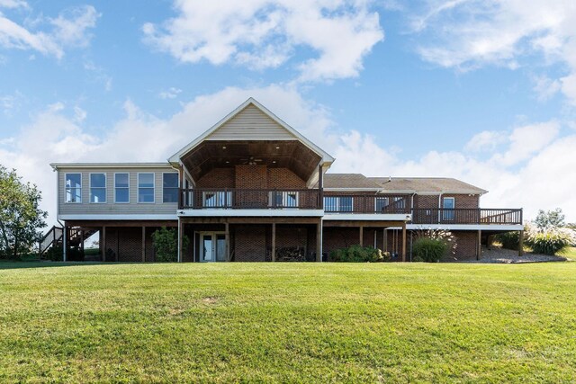 back of house with a wooden deck and a yard