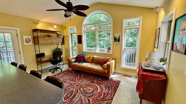 sunroom / solarium featuring vaulted ceiling and ceiling fan