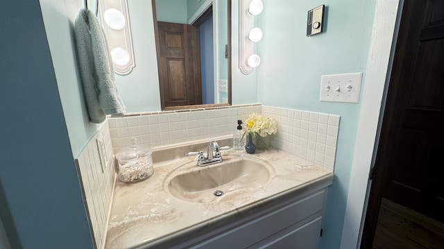 bathroom with vanity and backsplash