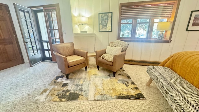 living area with carpet and baseboard heating