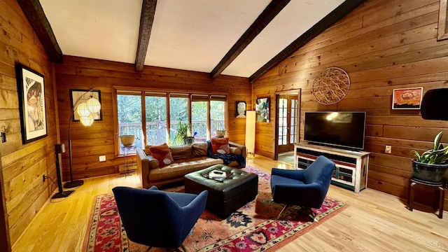 living room featuring wooden walls, light hardwood / wood-style floors, and vaulted ceiling with beams