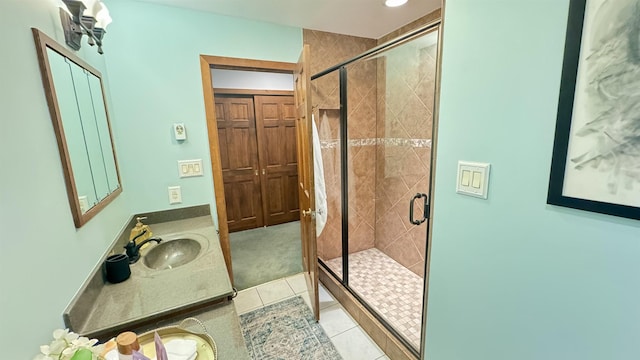 bathroom featuring vanity, tile patterned floors, and walk in shower