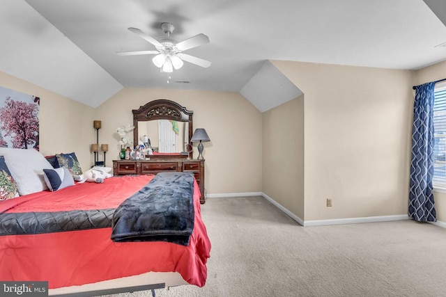 bedroom featuring ceiling fan, vaulted ceiling, and light carpet