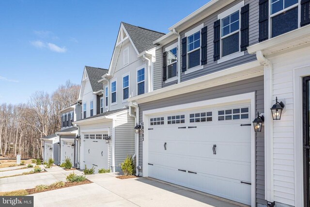 view of side of property with a garage