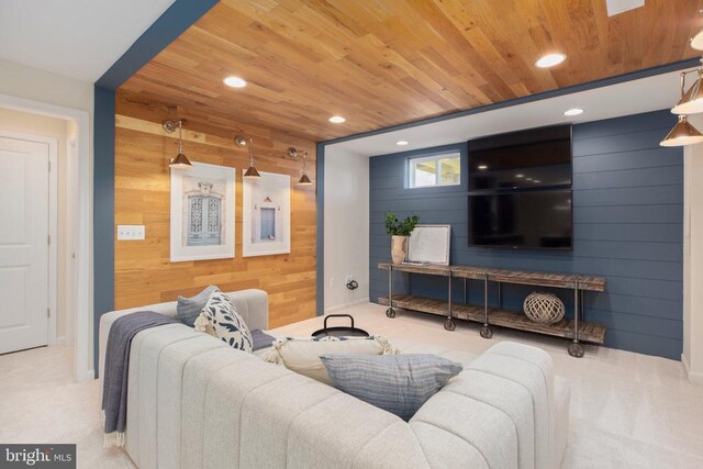 carpeted living room with wooden walls and wood ceiling