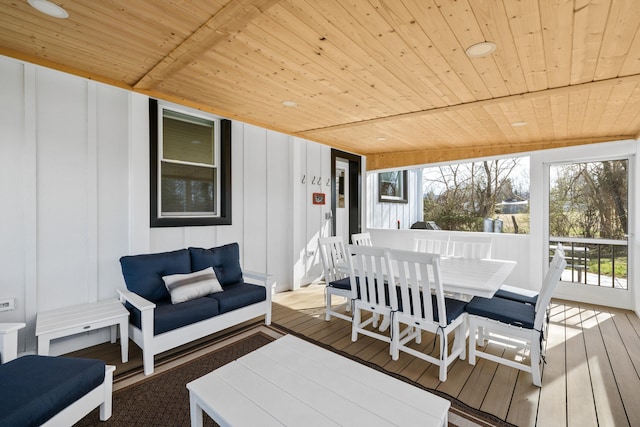 wooden terrace featuring outdoor dining space
