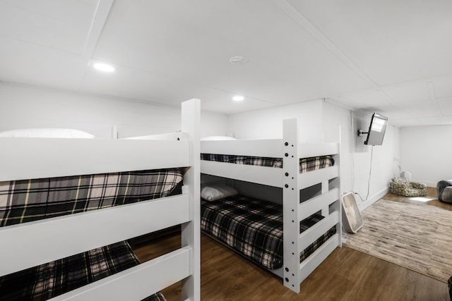 bedroom featuring recessed lighting and wood finished floors