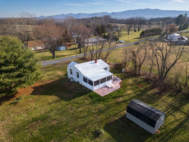 drone / aerial view featuring a mountain view