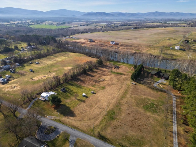 bird's eye view featuring a water and mountain view and a rural view