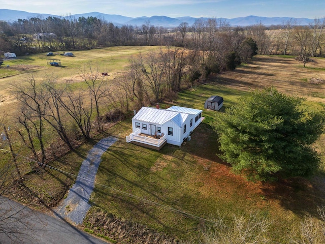 drone / aerial view with a rural view and a mountain view