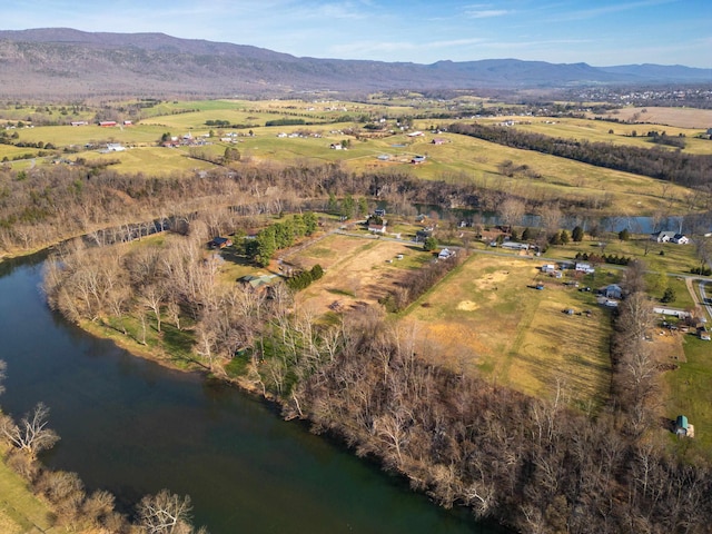 birds eye view of property featuring a water and mountain view