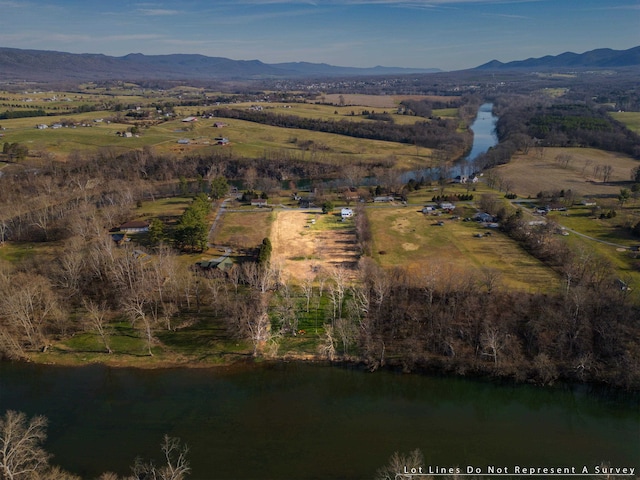 birds eye view of property with a rural view and a water and mountain view